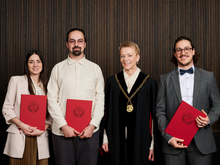 The three awardees with the Rector of the University of Bern